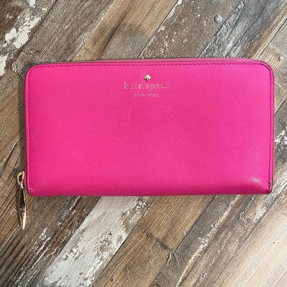 kate spade Handbags - kate spade bright pink zip-around wallet with gold-tone logo